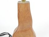 a wooden lamp with a cord attached to it