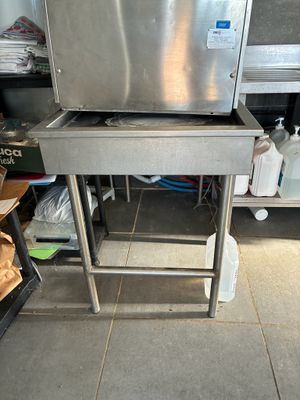 a stainless steel oven sitting in the middle of a kitchen
