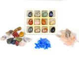 a tray of rocks and stones on a white surface
