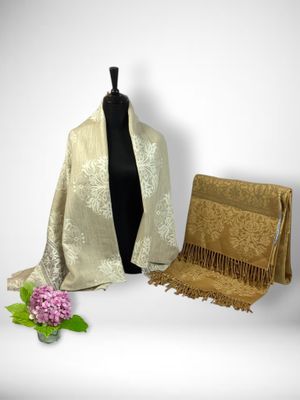 an image of a woman ' s shawl and a purse on a mannequin dummy