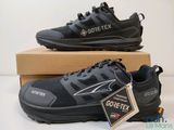 a close up of a pair of black shoes on a box
