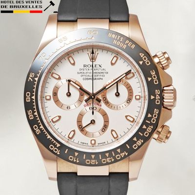 rolex watch with rose gold bezel and black rubber strap