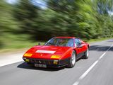 a red car that is driving down the road