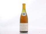 a bottle of wine that is sitting on a table
