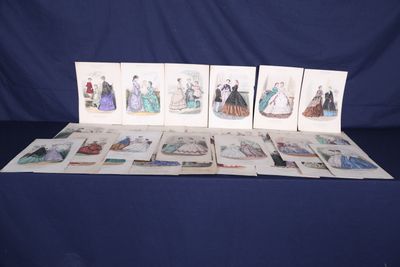 several cards of women ' s fashions on a table with a blue background