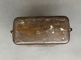 a small metal box that is on a table