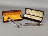 two silverware items are sitting in a case on a table