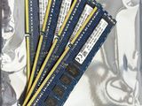 four memory modules are sitting on top of a plastic bag