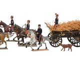 many figurines of men riding on horses and carts