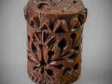 an antique carved wooden box with a carved design on it