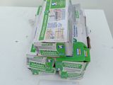 several boxes of food sitting on top of a table next to a piece of paper