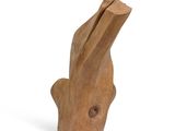 a wooden sculpture of a hand holding a piece of wood