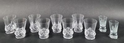 six shot glasses are lined up in a row on a table