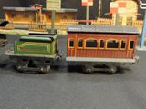 two toy trains that are sitting on a table