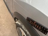 a close up of a car with a ruler on the side of it