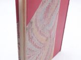a pink book with a paisley design on it