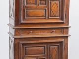 an old wooden cabinet sitting on top of a hard wood floor