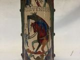 a vase with a picture of a horse and rider on it