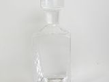 an image of a clear glass bottle on a white background