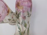 two vases that have been painted with flowers on them