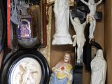 a box full of religious figurines and other religious items
