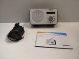 a radio and a charger sitting on a table