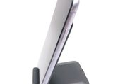 a cell phone that is sitting on top of a stand
