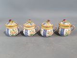 three small blue and white teapots with flowers on them