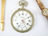 a gold watch and a gold wrist watch next to each other