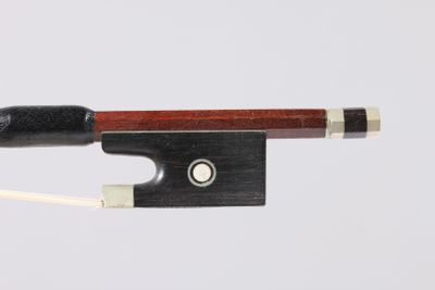 the bow is made of wood and has a black handle