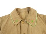 beige jacket with green trims and buttons on a white background