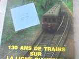 un livre sur lequel figure l'image d'un train qui arrive sur les rails