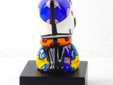 a figurine of a motorcycle with a helmet on it
