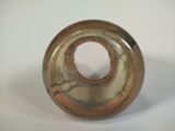 a glass vase with a hole in it on a white surface