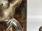 a metal object that is shaped like a mouse