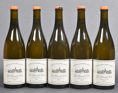 six bottles of wine are lined up on a table