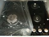 a picture of a stove top that is wrapped in plastic