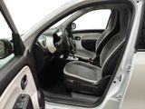 the interior of a car with the door open and the driver ' s seat down