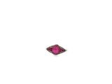 a close up of a pink stone ring on a white surface