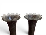 two vases that are sitting next to each other on a table