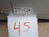 a piece of paper taped to the side of a refrigerator