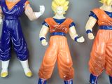 three action figures of goku and vegeta from dragon ball