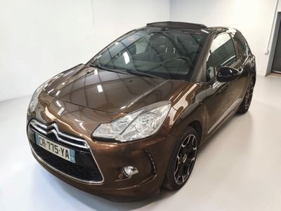 a brown citrole is parked in a white room