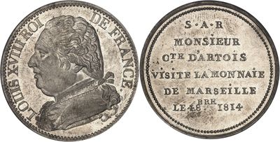 une pièce en argent portant le portrait d'un homme