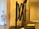 a lamp that is sitting on a table next to a mirror