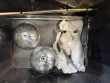a metal tray with a bunch of metal balls inside of it