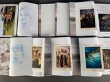 several books with pictures of people on them sitting on a table