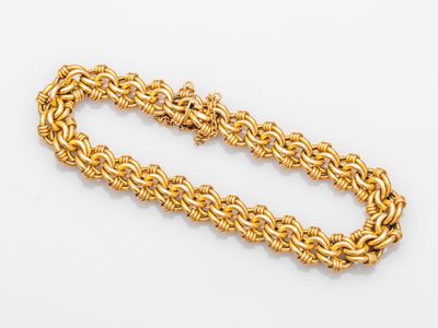 a gold chain bracelet with a clasp