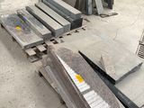 many pieces of granite sitting on a pallet