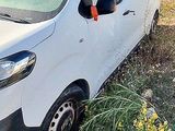 a white van that is parked in the grass